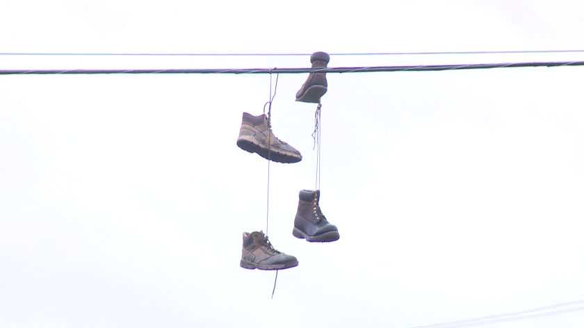 Shoefiti: Why People Hang Shoes on Power Lines | Hanging shoes, Why people,  Hanging